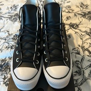 Women Black Leather High rise Converse.(Chuck Taylors)
